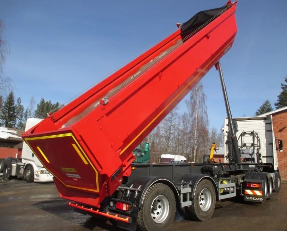 Red tipper truck with raised dump body