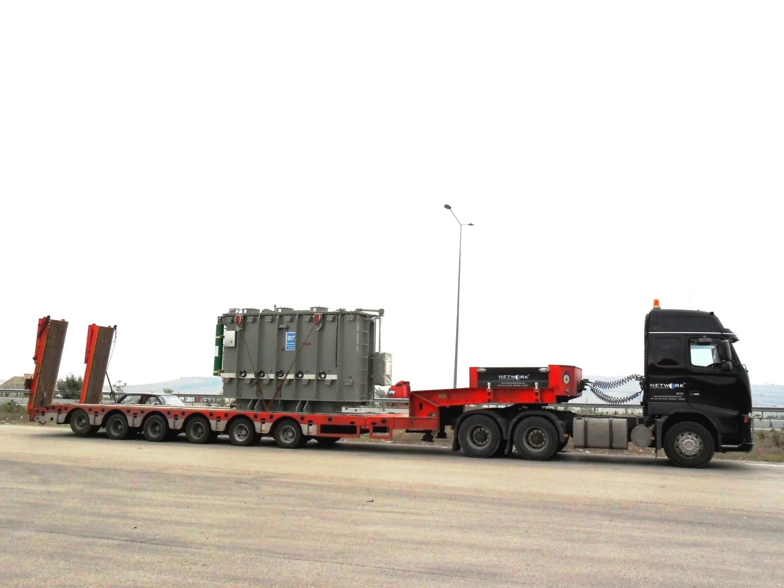 Transformer secured on a lowbed trailer
